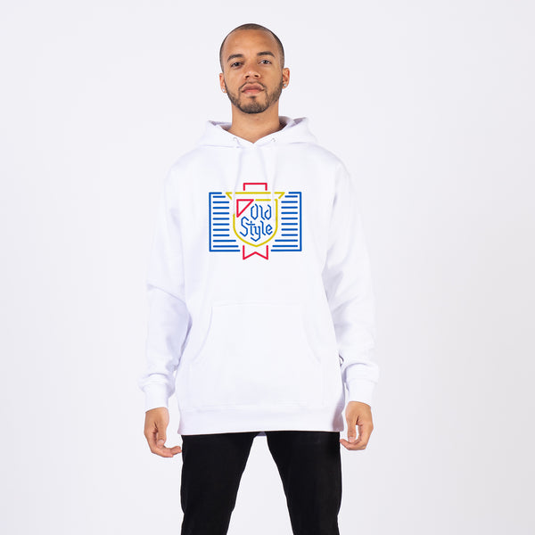 front of man wearing hoodie with neon sign of old style beer logo on it